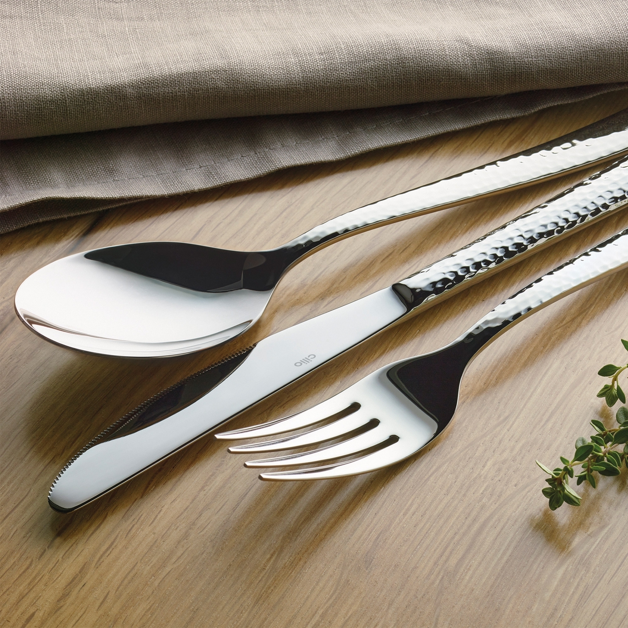 Spoon, knife and fork in polished stainless steel